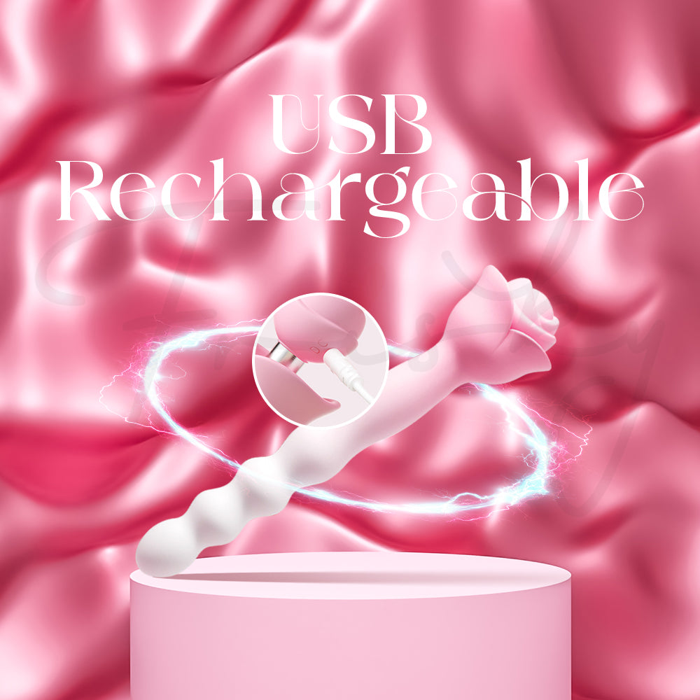 Rosy Arc vibrator placed beside USB charging cable with satin pink background.