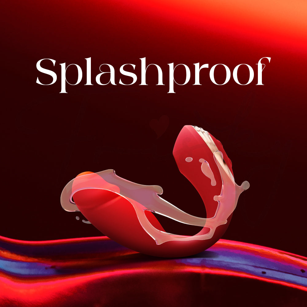 Red U-shaped vibrator under flowing water demonstrating its splashproof capability