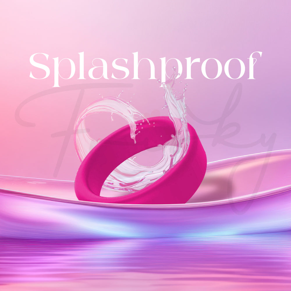 Pink silicone ring partially splashed with water to illustrate splashproof design