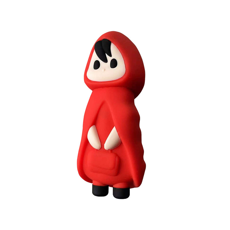 Toy figure in a red hooded outfit on a white background