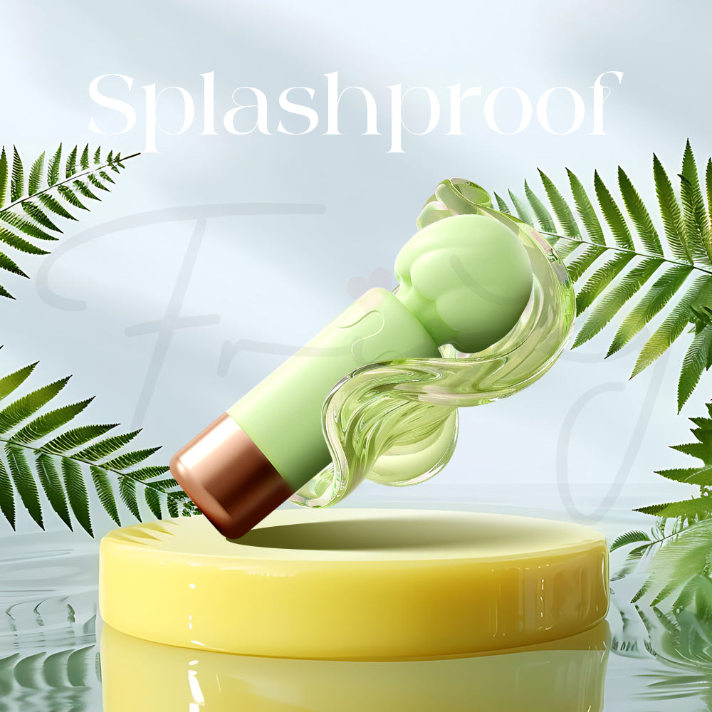 Mint-green vibrator under gentle water splash demonstrating its splashproof capability.