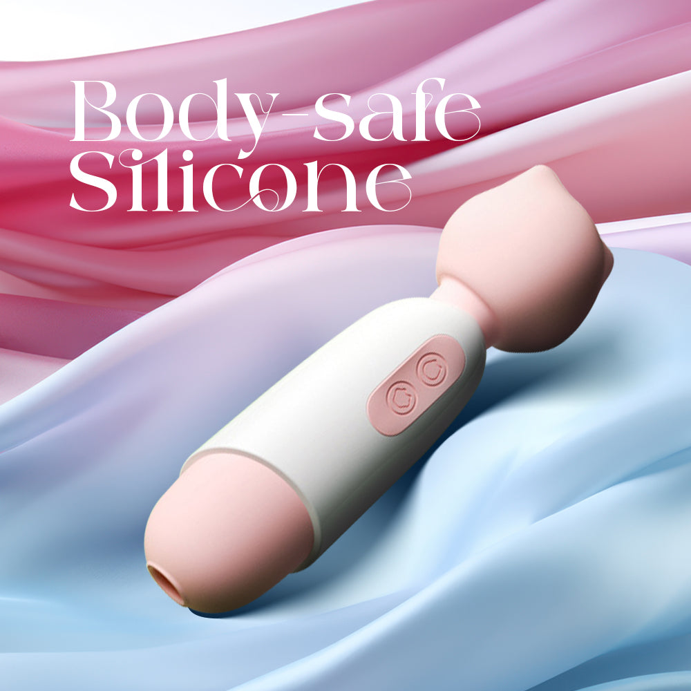 Sakura Purr wand on blue silk fabric emphasizing its smooth body-safe silicone finish.