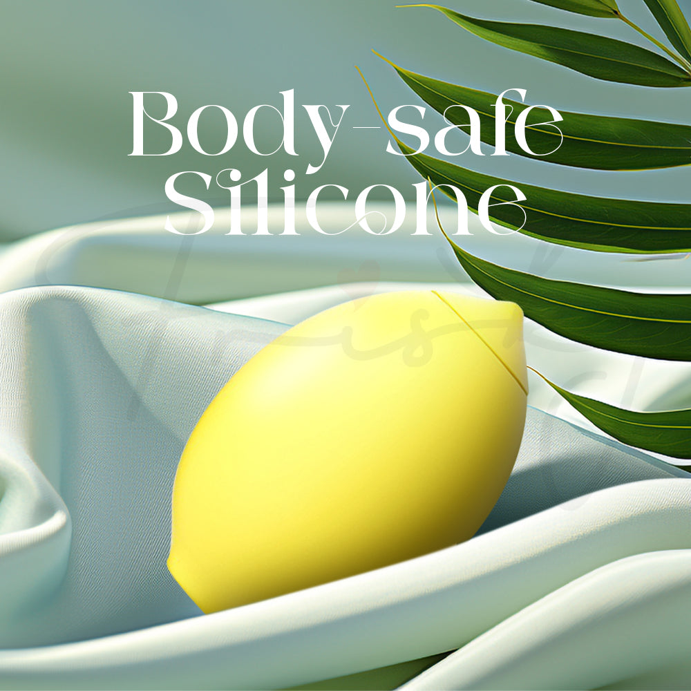 Body-safe silicone yellow bullet vibrator resting on soft fabric background