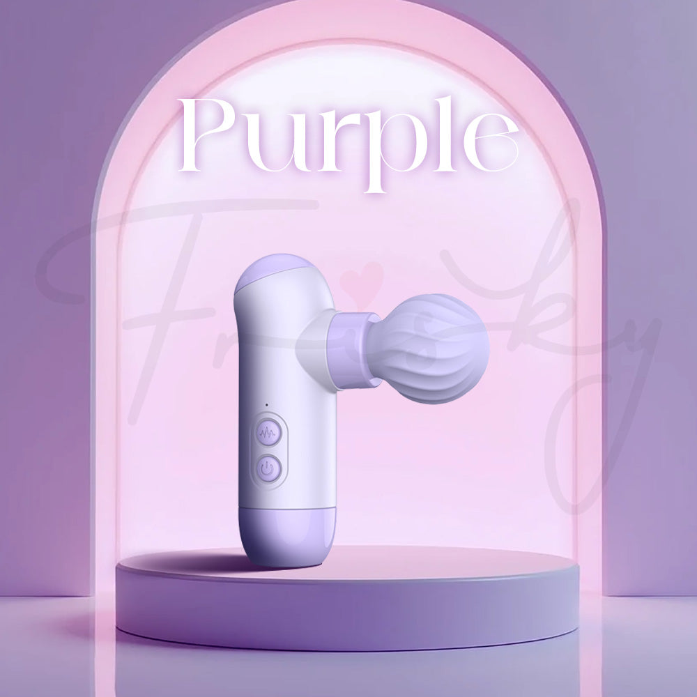 Purple dual-head massage style vibrator displayed on matching pastel platform