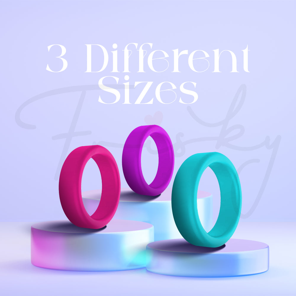 Three silicone rings in different colors arranged together to show size variations.