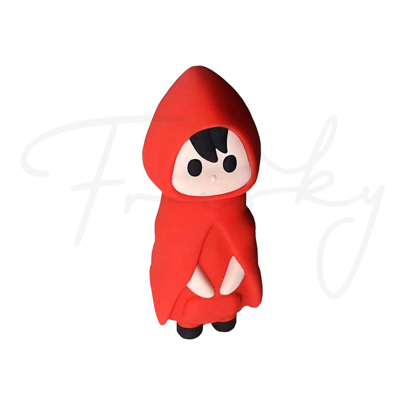 Toy figure of a character in a red hood on a white background