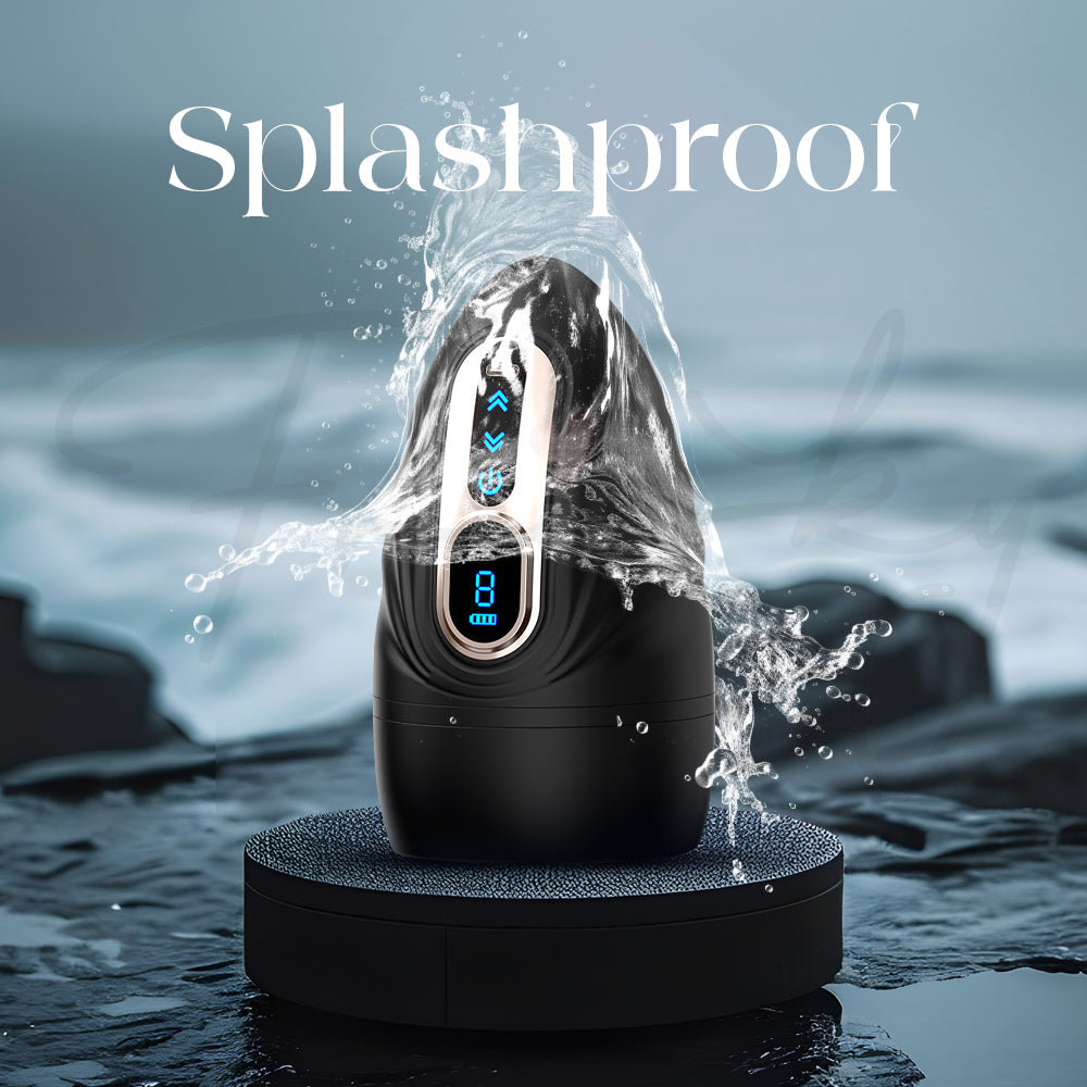 Black vibrator with water droplets splashing over it to emphasize its splashproof design.