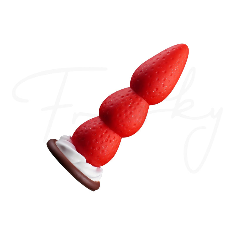 Strawberry-textured graduated plug resting at a diagonal angle on a white background