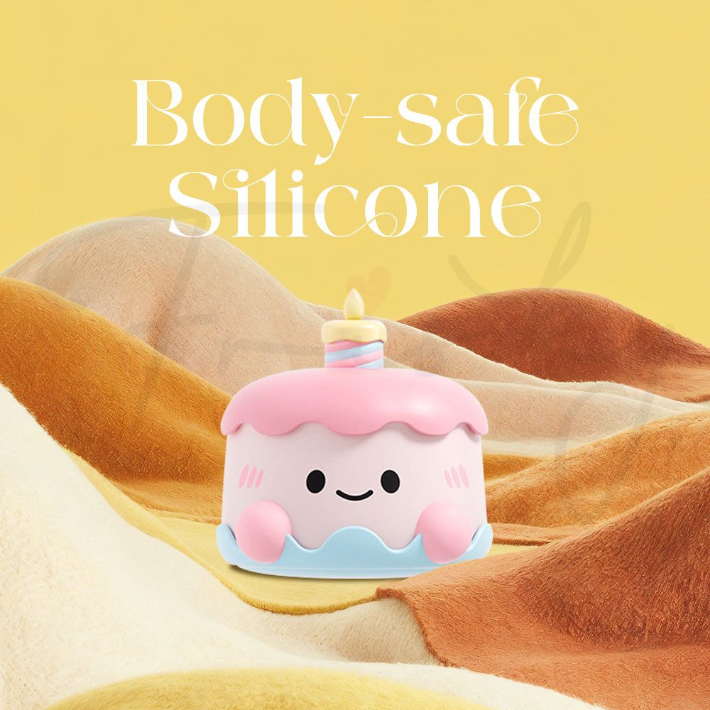 Pink massager resting on fabric emphasizing smooth and skin-friendly silicone material
