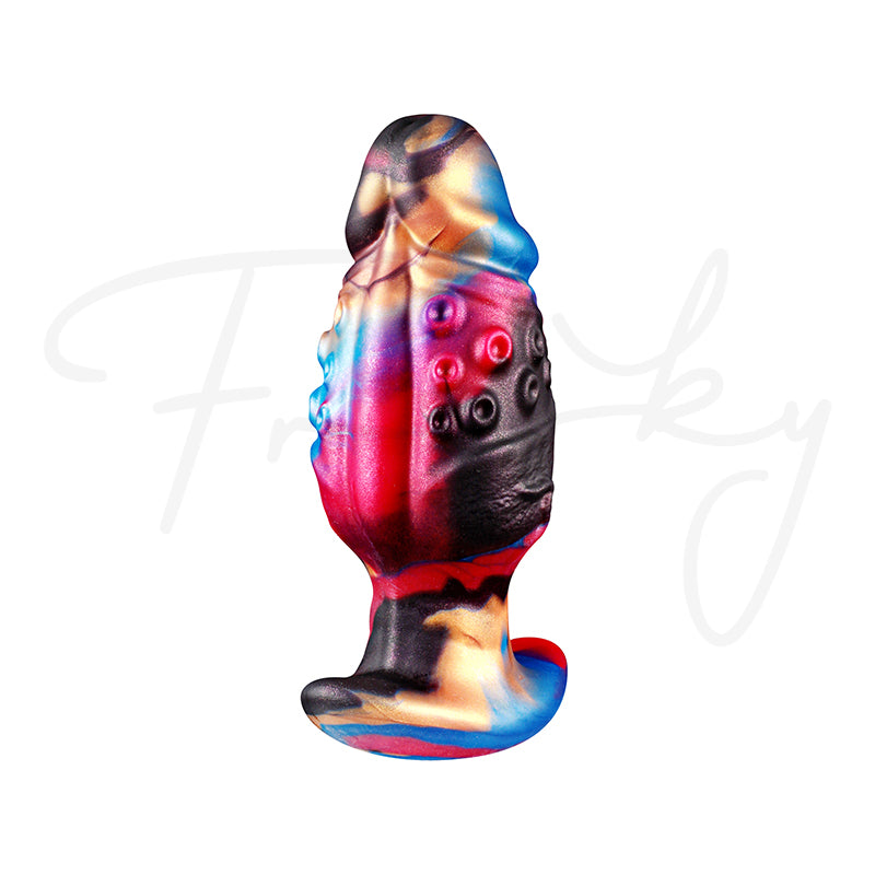 Side view of colorful tentacle-inspired silicone plug showing textured ridges and contours.