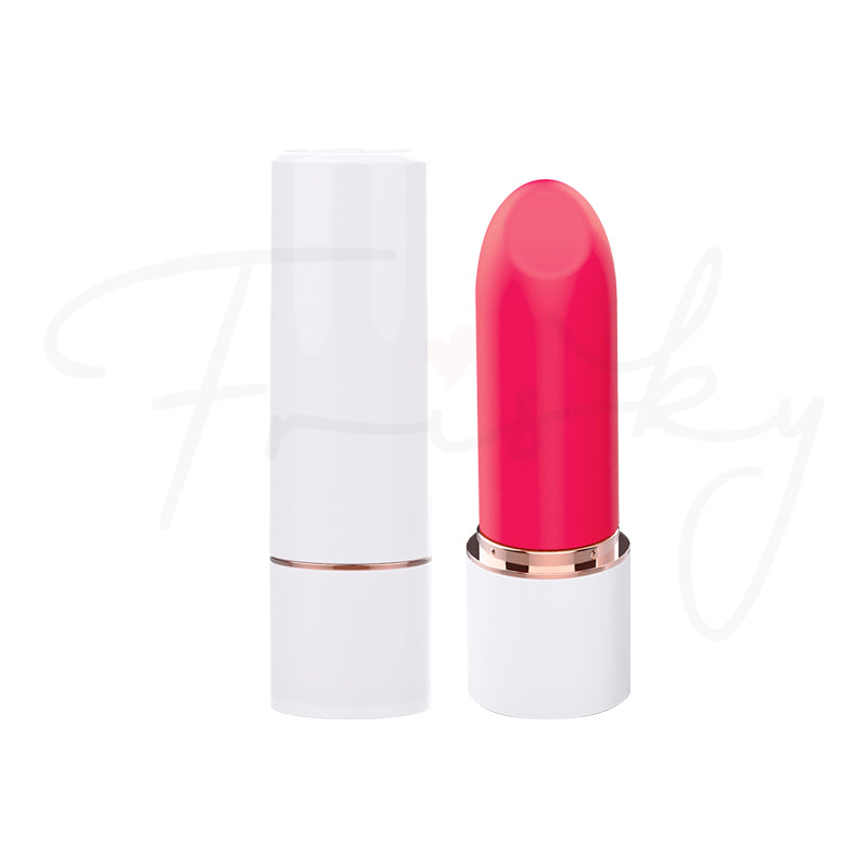 Pink lipstick-style bullet vibrator with white base standing upright on a plain white background