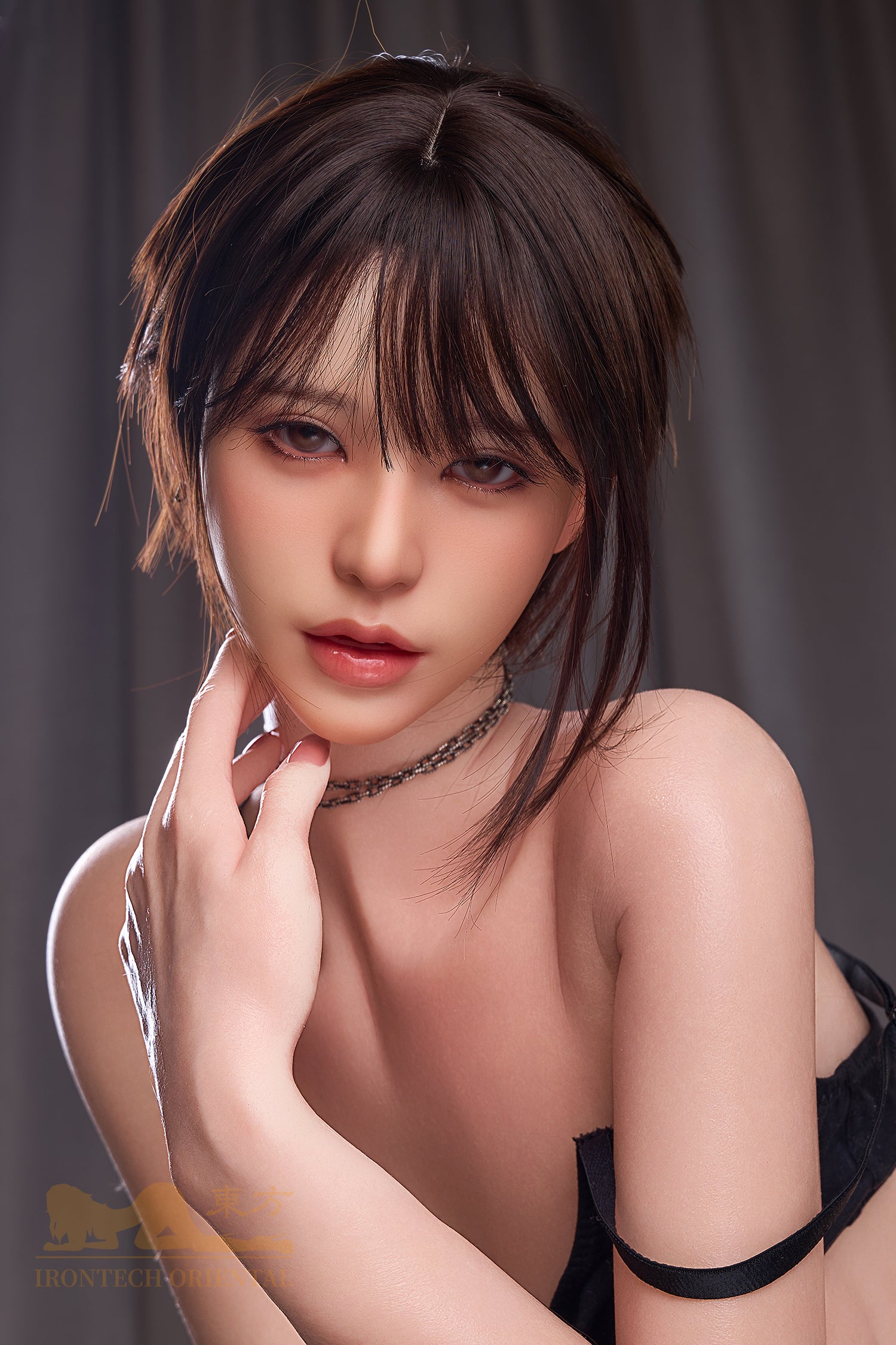A high-detail close-up of the Irontech Doll 153 cm E Oriental Series Silicone – Yuna V3 focusing on the realistic facial sculpt, soft lip color, and delicate neck jewelry.