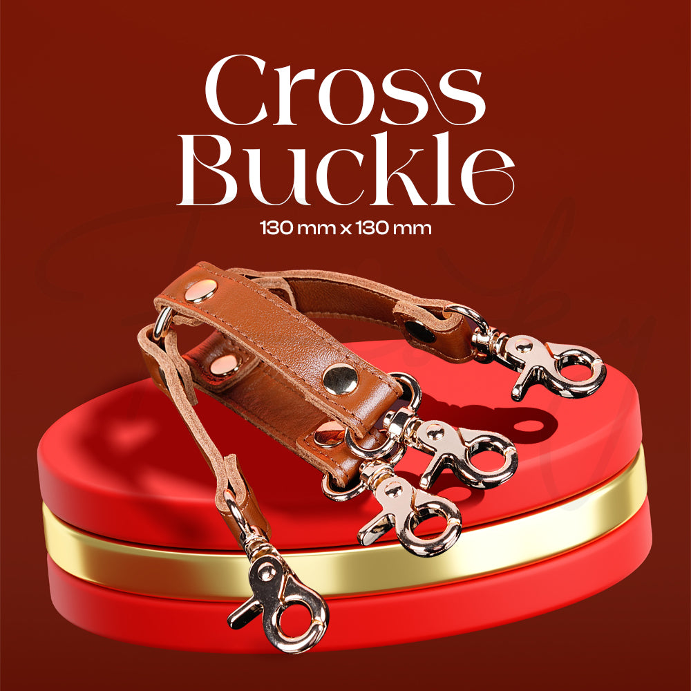 Cross buckle restraint connector for versatile positioning and attachment options