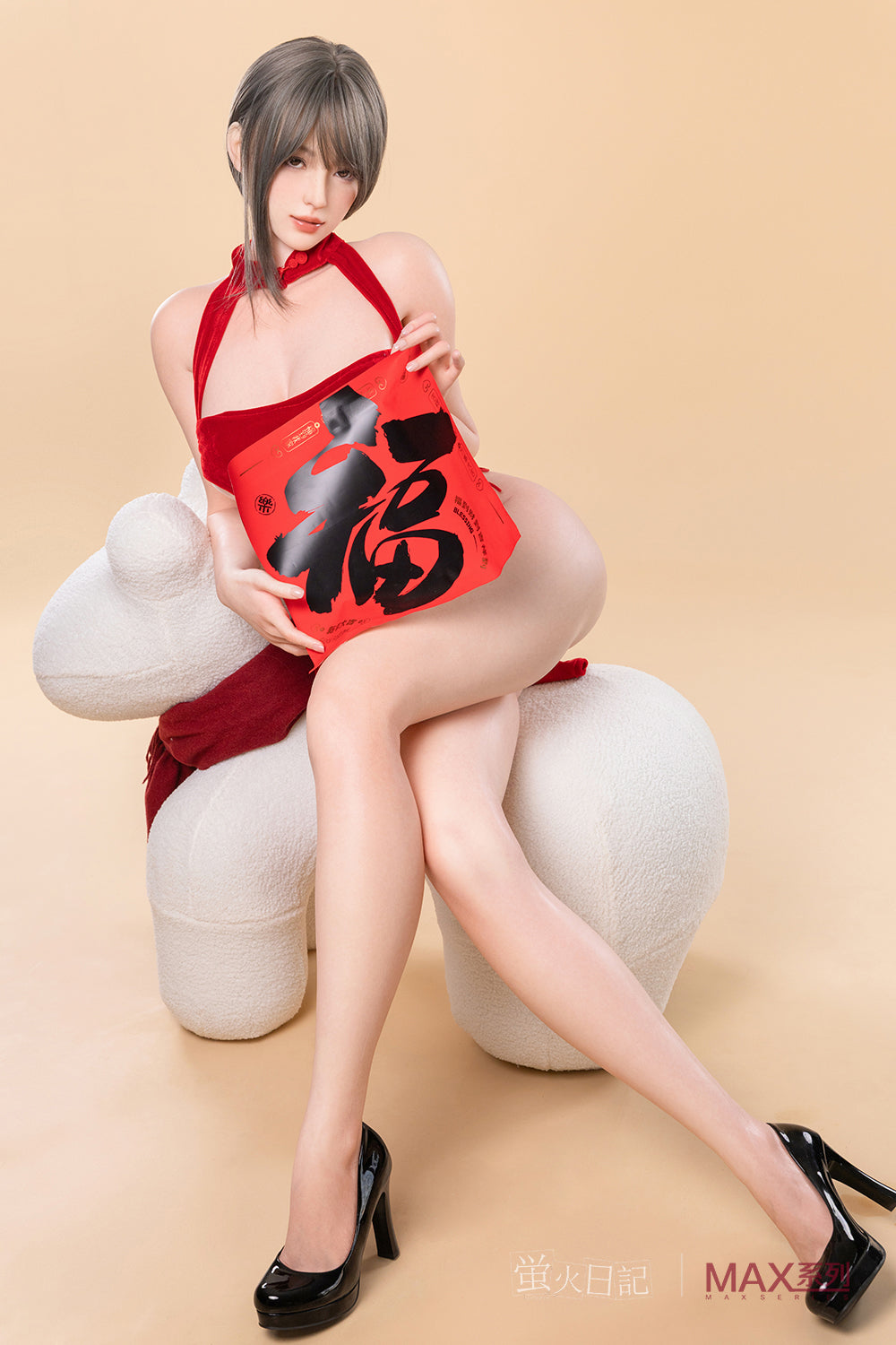 Firefly Diary Doll 165 cm Max Series Silicone - Yelan sitting on a white plush chair, wearing a red velvet halter outfit and black heels while holding a red decorative sign.