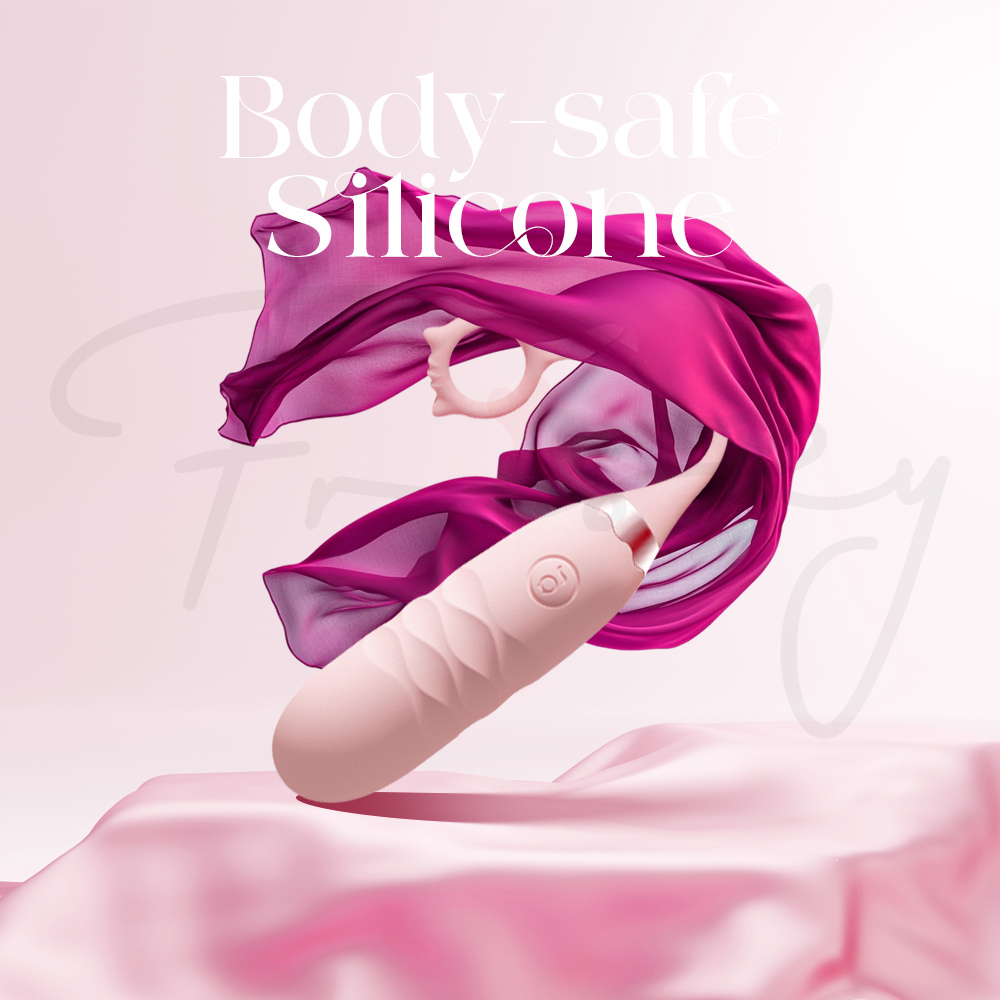 Close-up of Pink Pounce on silky fabric with feather, showcasing body-safe silicone material.