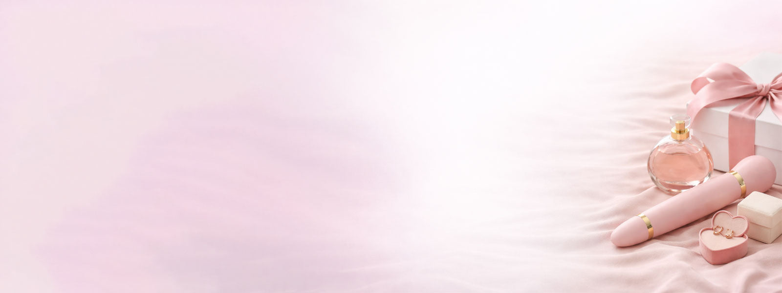 Pink perfume bottle, box, and makeup items on a light pink background