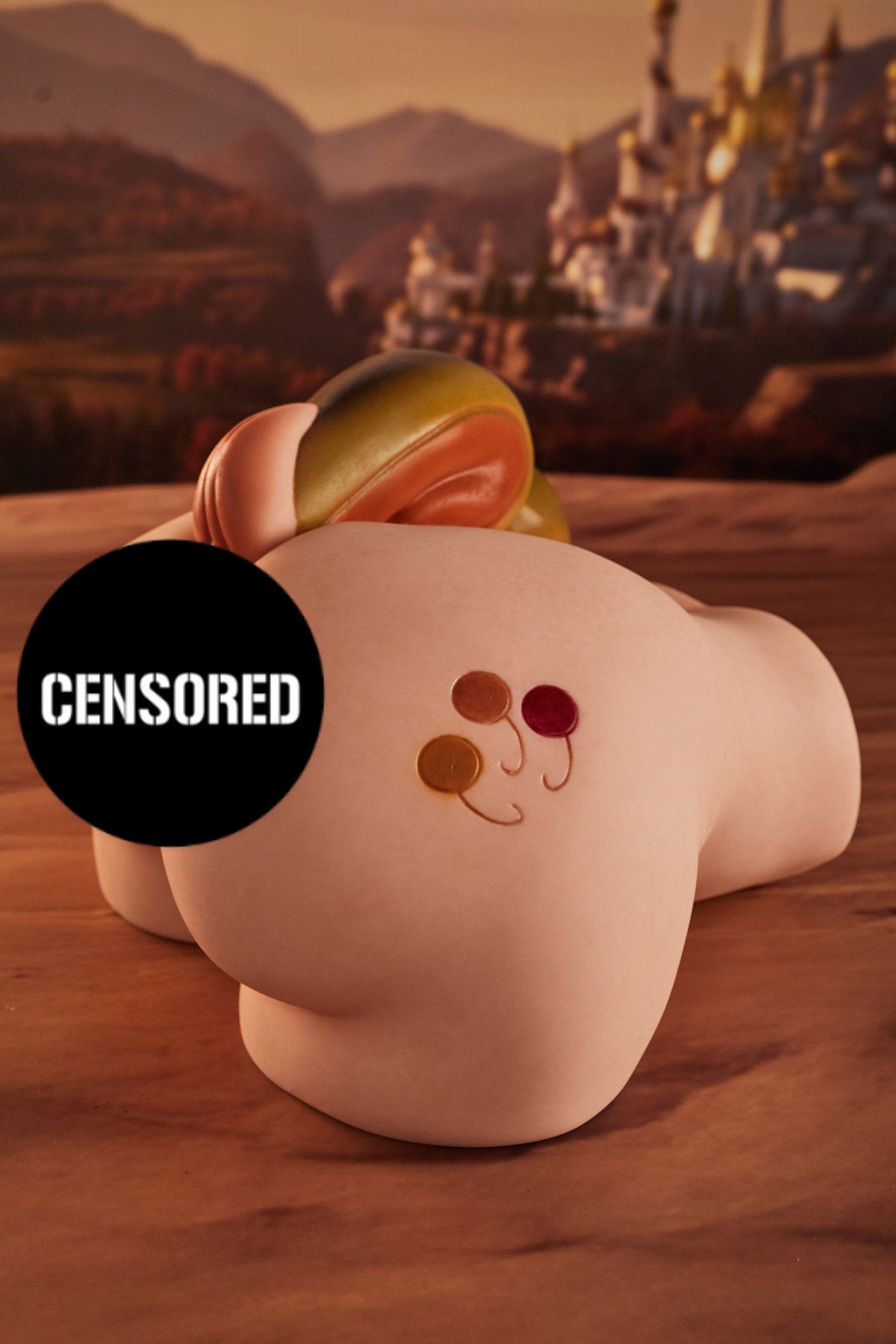CLIMAX DOLL - PA-Peppy Silicone Butt Torso (Cinnamon) rear three-quarter view with yellow horn accessory detail, desert ruins background
