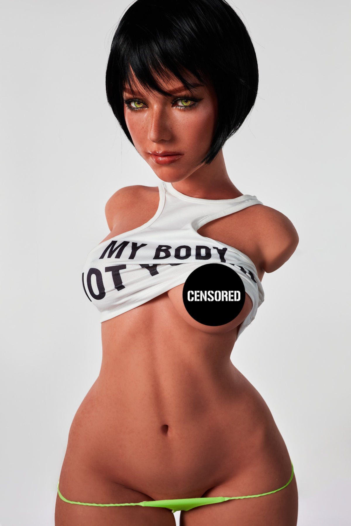 A frontal view of the CLIMAX DOLL - ULW 882# Silicone Torso - Livia (Black) with the white crop top pulled up to expose the chest, paired with neon green bikini bottoms.