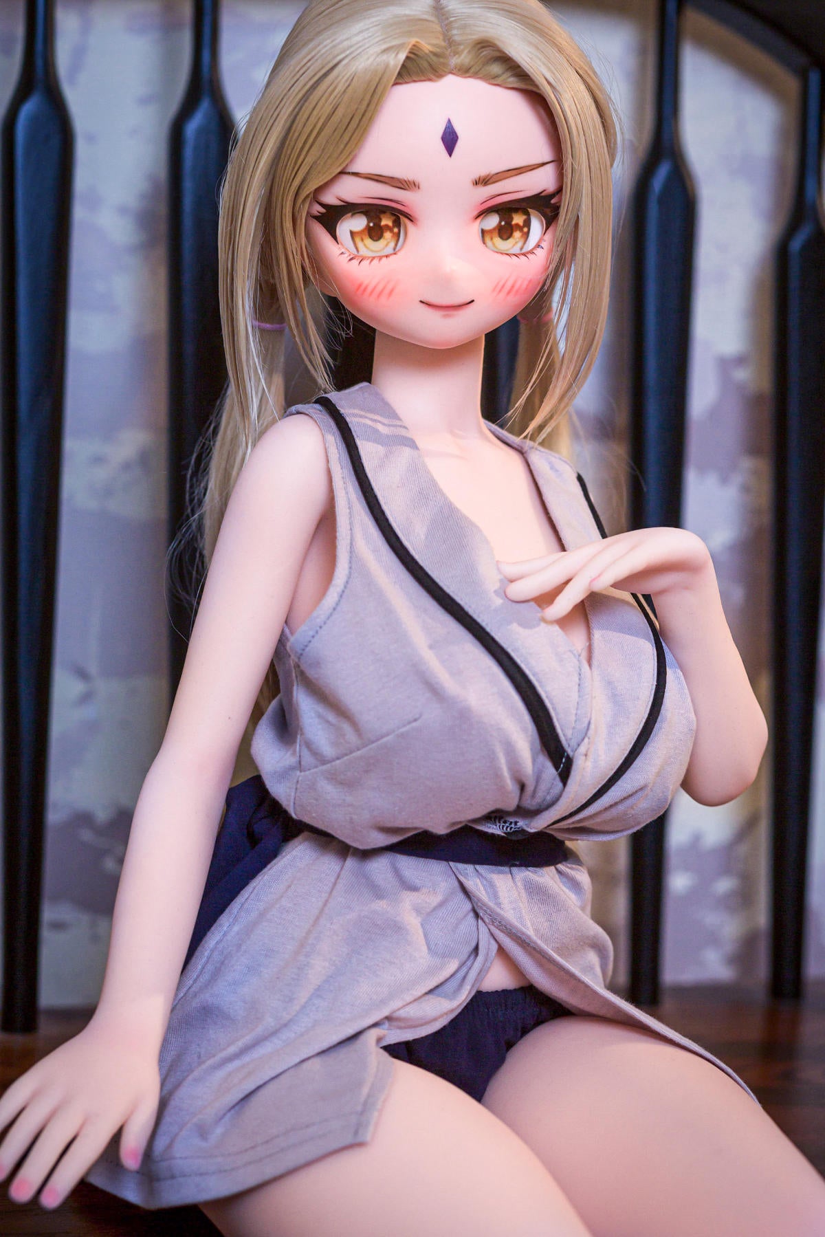 CLIMAX DOLL Mini J60cm B Hybrid - Reyna (Cinnamon) – seated pose with hand raised, robe showing her full bust
