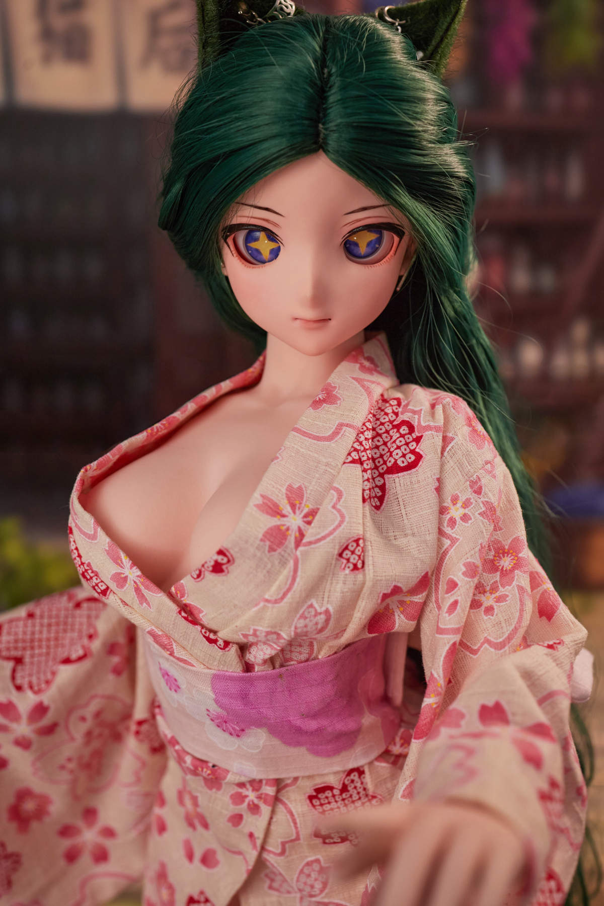 CLIMAX DOLL Mini J60cm Hybrid - Momo (Cinnamon) standing in a pink floral kimono, teal-green hair, hand extended, brick wall alley backdrop