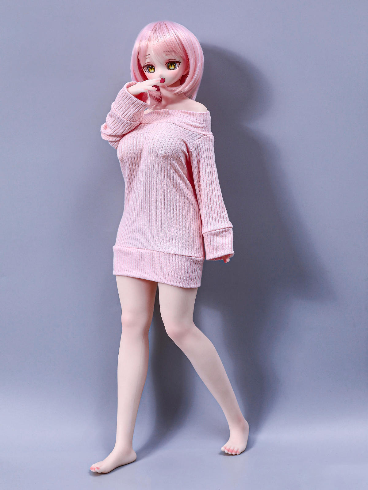 CLIMAX DOLL Mini J60cm P Hybrid - Azami (Cinnamon) mid-stride walking pose with one leg lifted, long-sleeved pink sweater dress, short pink bob