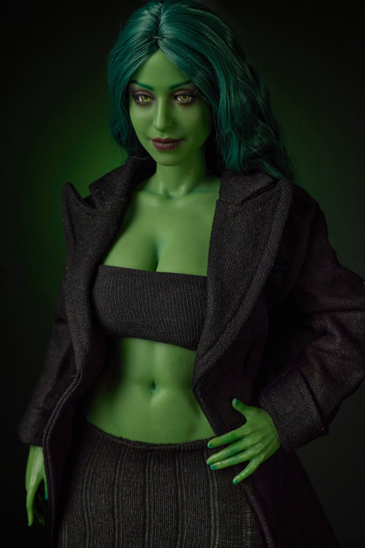 CLIMAX DOLL Mini Si70cm KA Silicone - Renee (Green) full body standing pose in black crop top and mini skirt with black jacket, long green hair, dark green studio background
