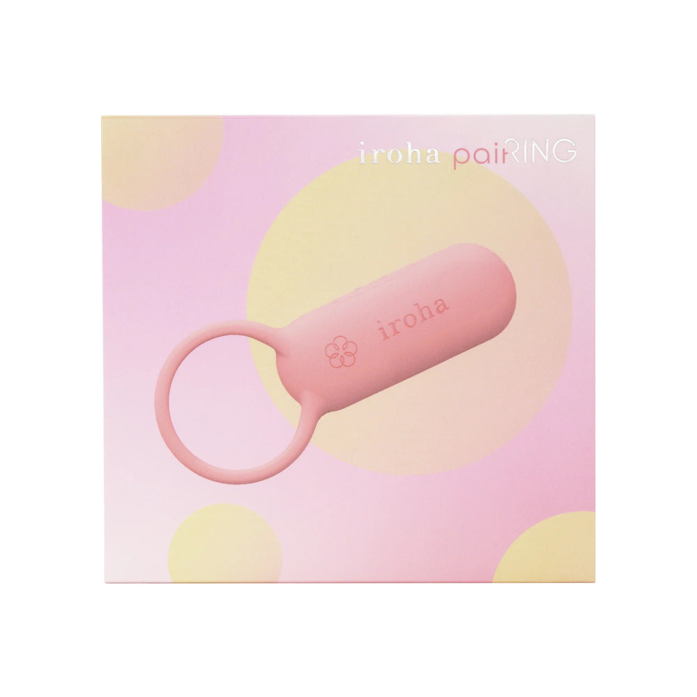 Hand holding compact pink wearable vibrator showing size and grip