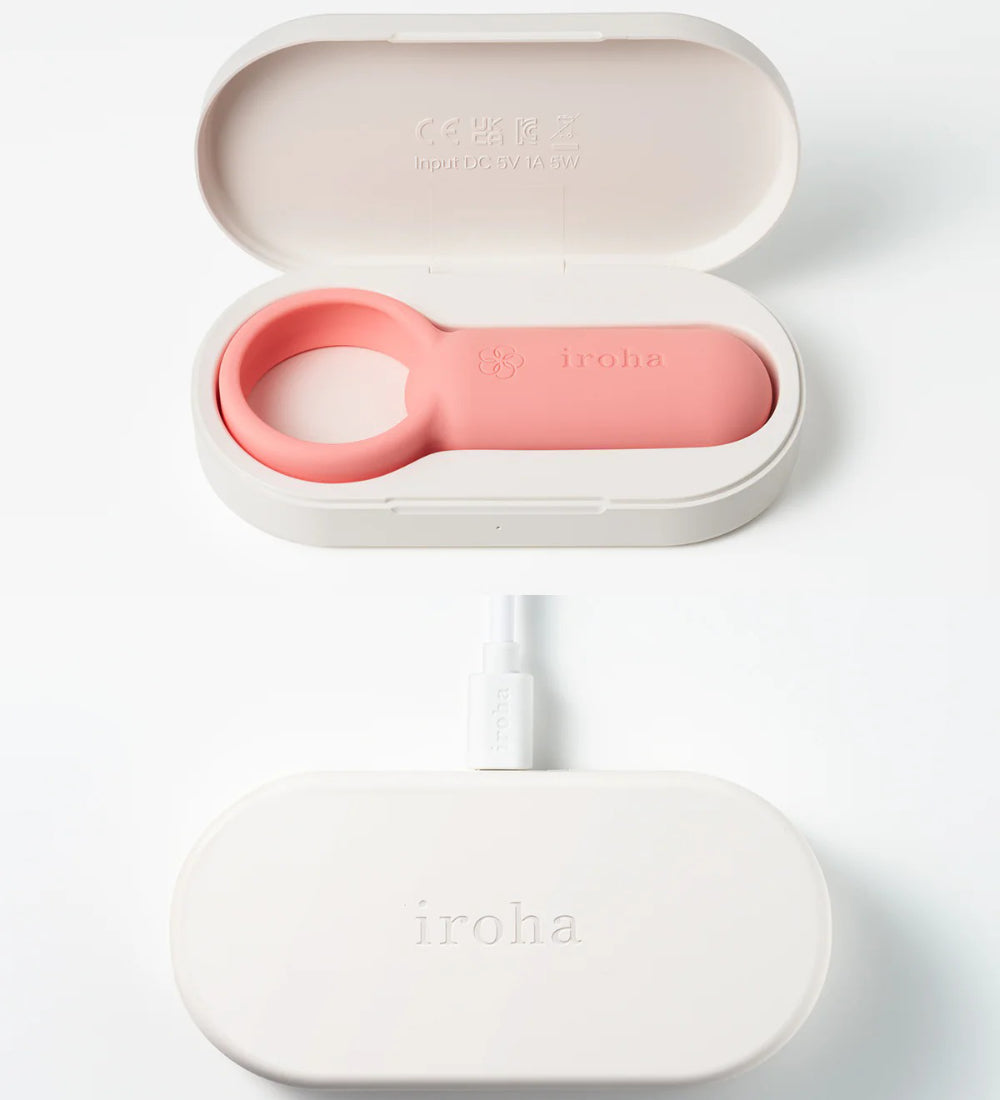 Closed charging case with compact pink vibrator resting neatly inside