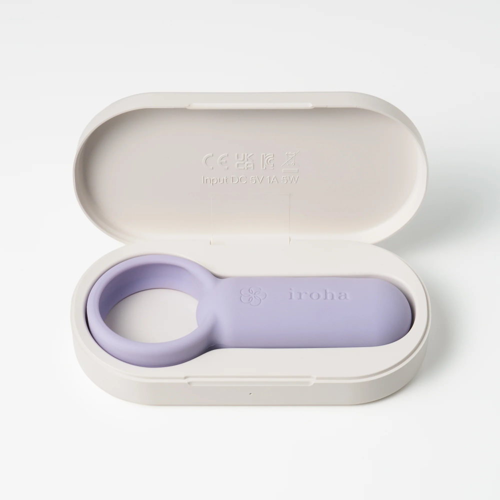Lavender ring in a white case on a light gray background