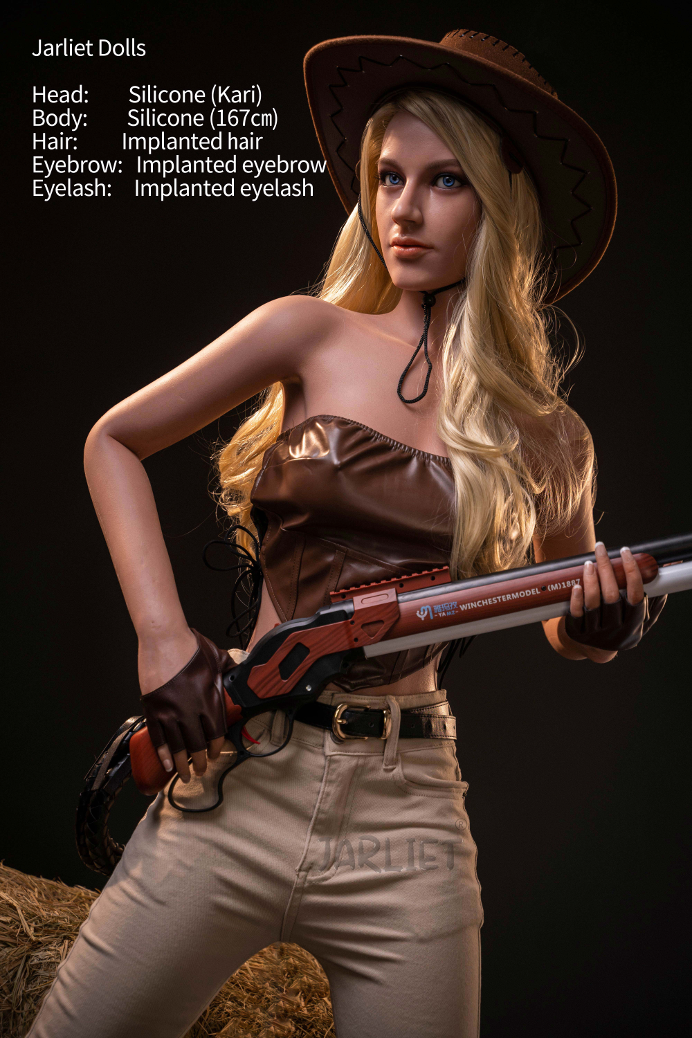 Jarliet Doll 167 cm B Silicone - Kari, posing in a western-themed outfit with a cowboy hat and holding a replica rifle against a dark background.