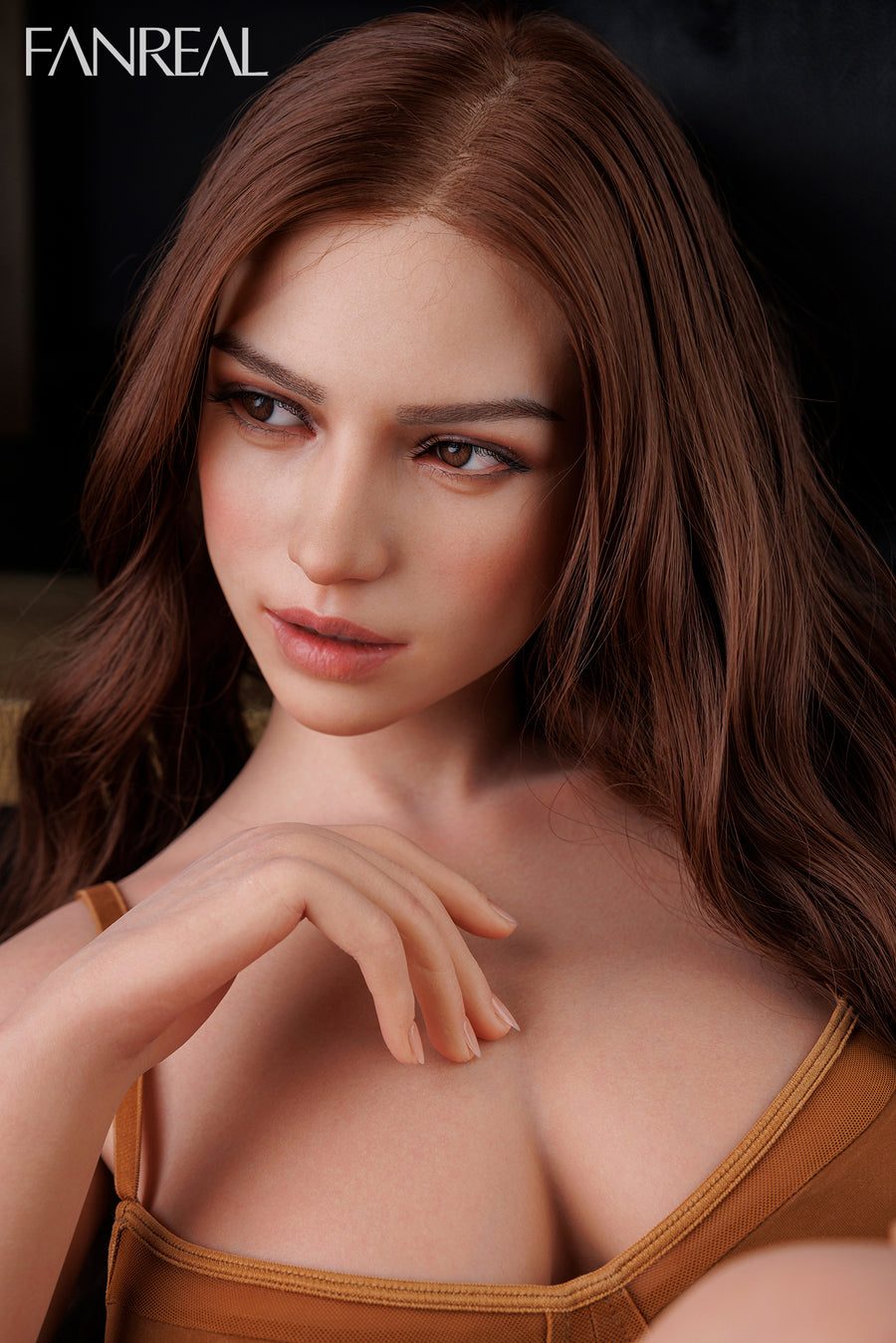 A close-up shot of FANREAL Doll Mirella V2 – 155cm F-Cup Silicone Sex Doll with Real Skin Texture with long brown hair wearing a brown top