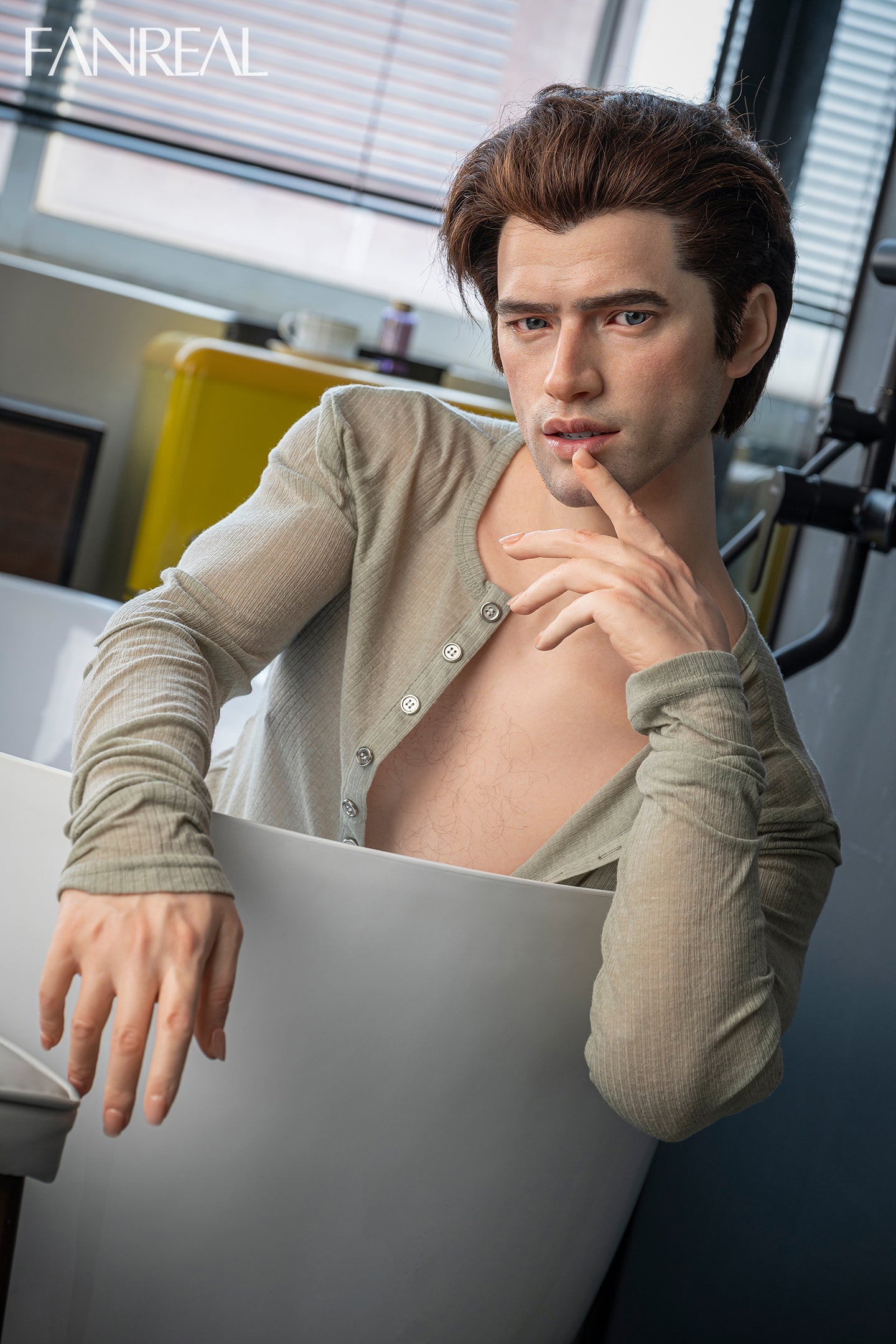 FANREAL DOLL 173 CM Silicone - Male Carter V2 wearing a beige cardigan in an indoor setting with blurred background