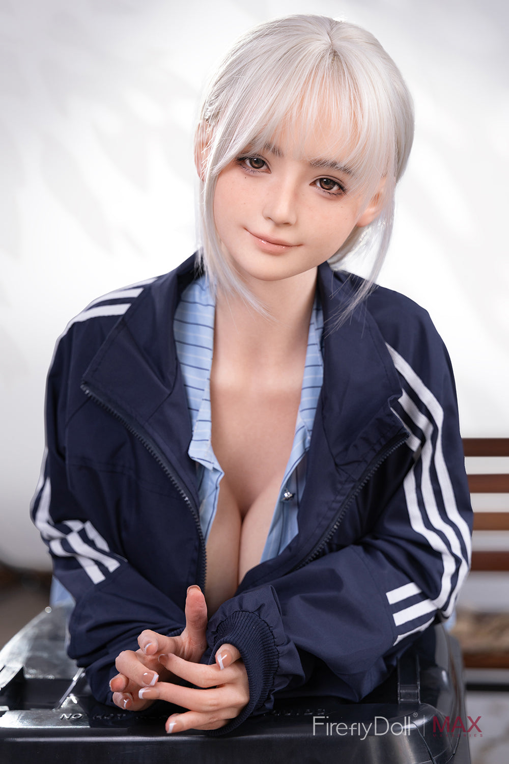 Firefly Diary Doll 160 cm Max Series Silicone - Qiandao V4 wearing a blue tracksuit with white stripes, sitting on a chair.