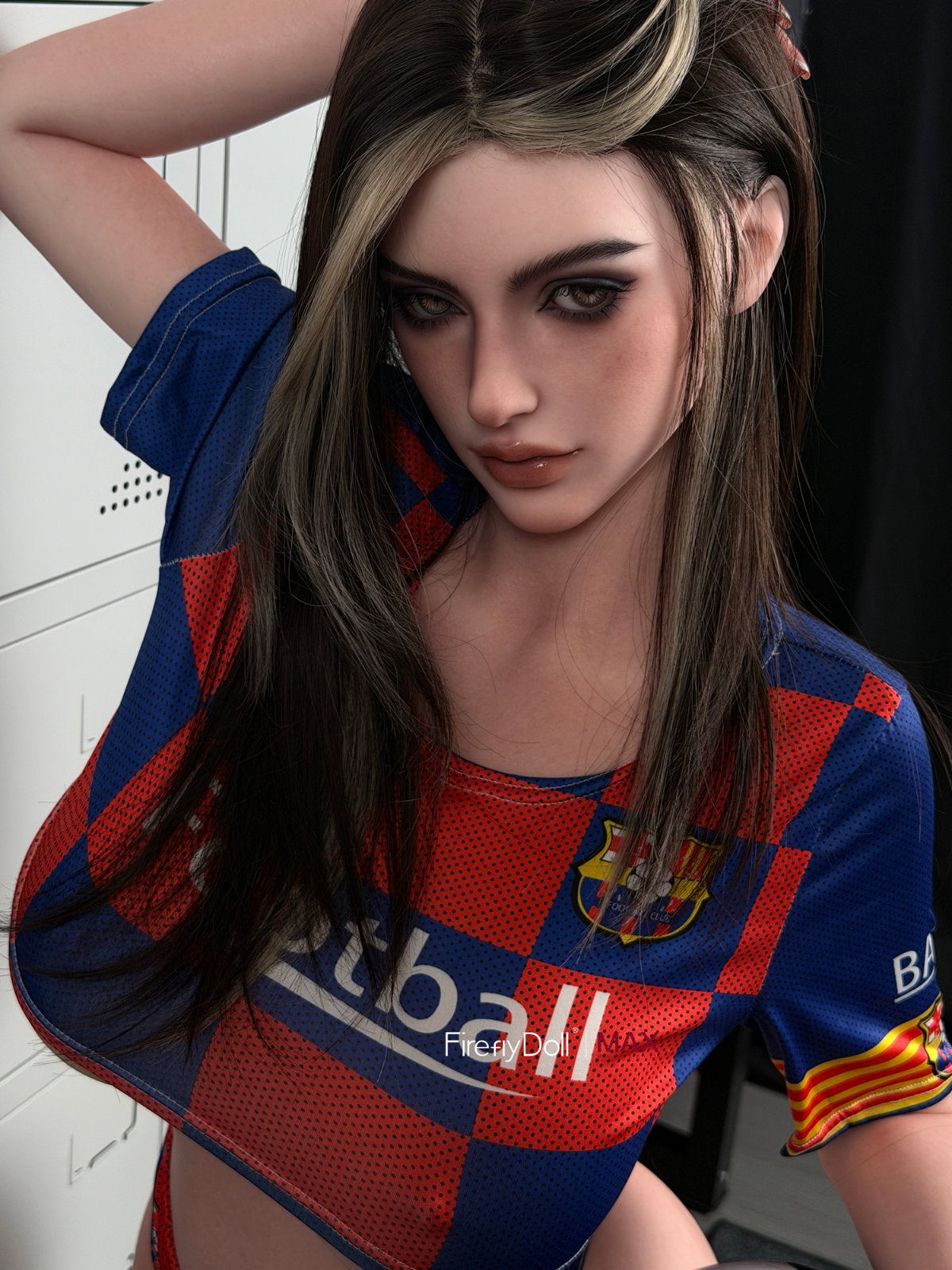 Firefly Diary Doll 160 cm G Max Series Silicone - Rona standing with one arm raised behind her head, wearing a red-and-blue football jersey, dark hair with blonde streaks, dramatic smoky eye makeup, locker room background