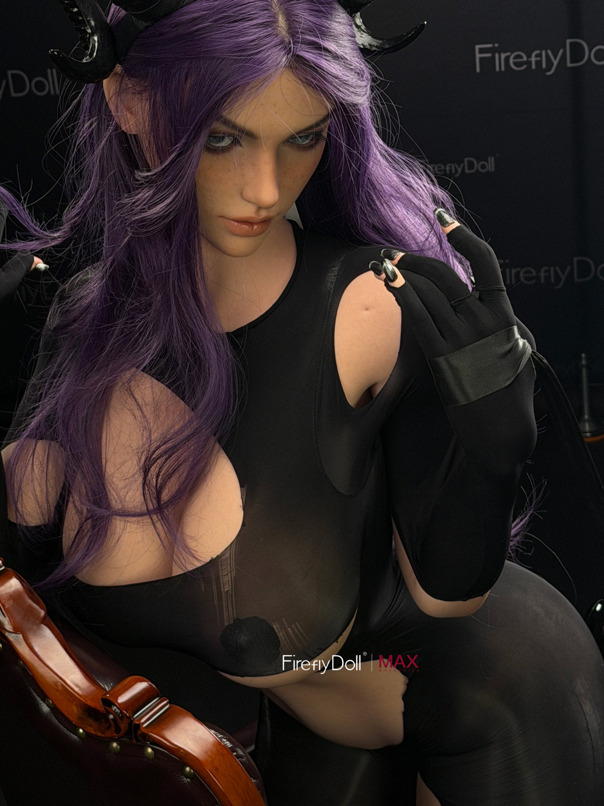Firefly Diary Doll 164 cm I-cup Max Series Silicone - Mary seated with one arm raised above her head, fitted black gothic outfit, dark atmospheric lighting