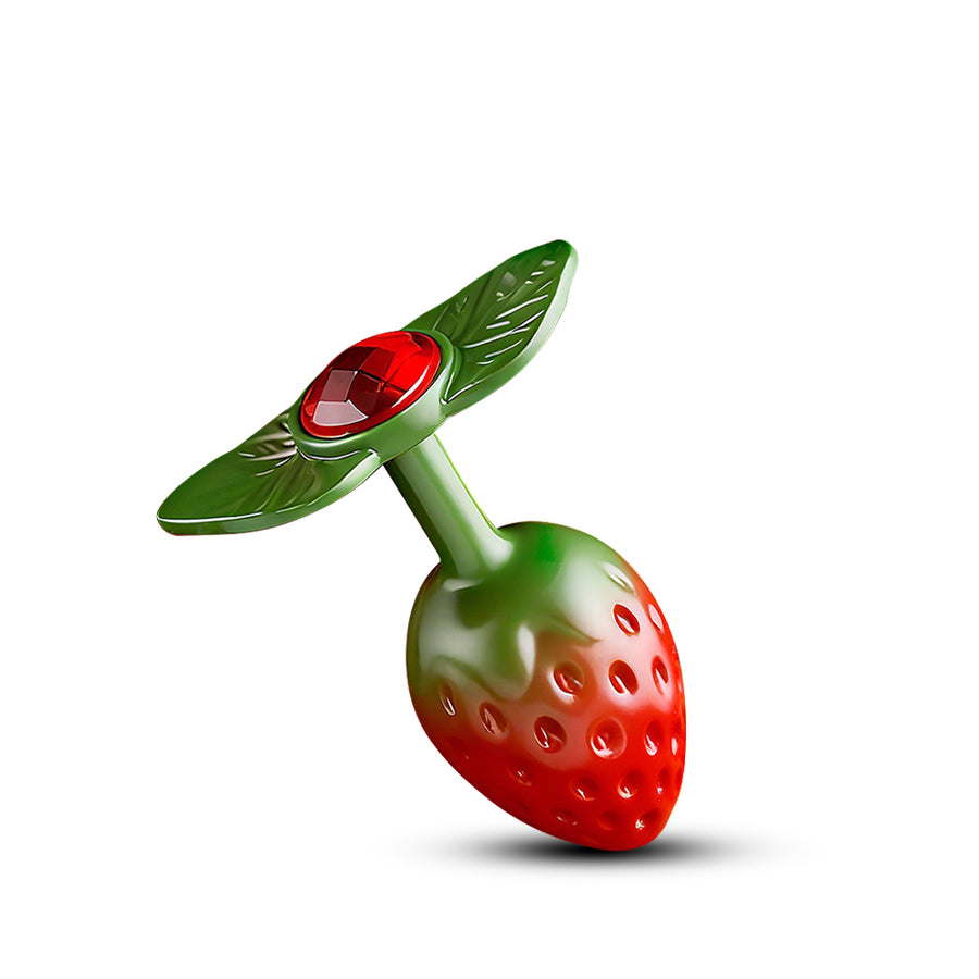 Strawberry-shaped metal plug with green leaf base and red gem accent detail