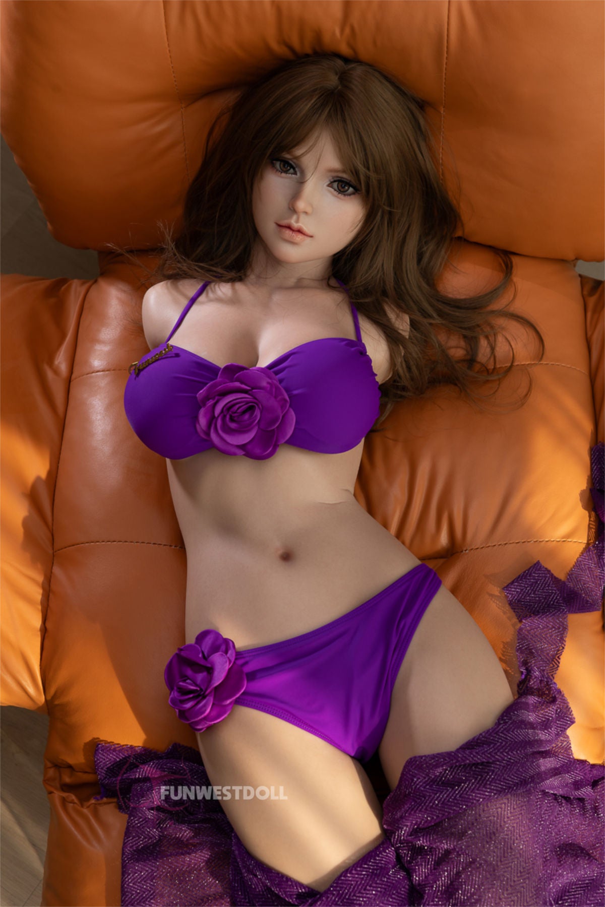 Top-down view of the FunWest Doll Lily 95 cm torso featuring realistic facial details and a purple floral bikini.