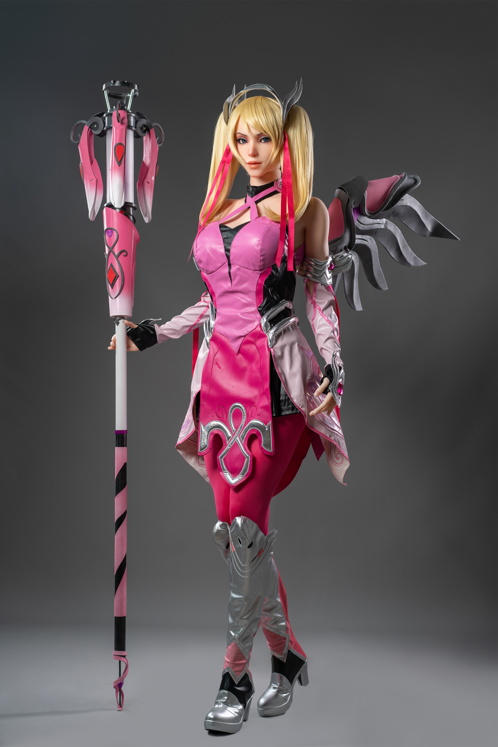 Game Lady 171 cm G Silicone - Mercy in a pink and black outfit with a staff.