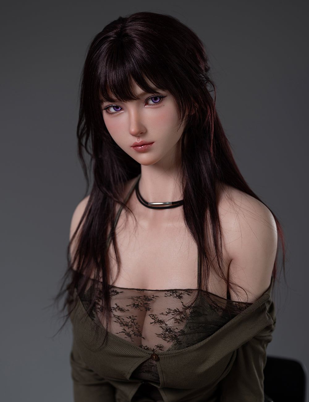A close-up portrait of TOP-CYDOLL 168cm F-Cup Iris Realistic Sex Doll with purple eyes and long dark hair, wearing an olive-green cardigan off the shoulders and a black lace top.
