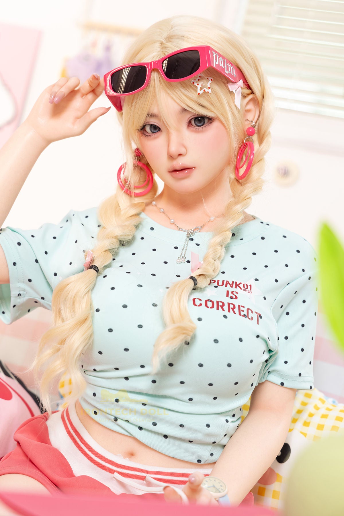 Irontech Doll 148 cm Plus B Silicone - Xia Ying full body standing pose in light blue polka dot crop jacket and pink skirt with pink sunglasses and blonde twin buns, bright kawaii bedroom background