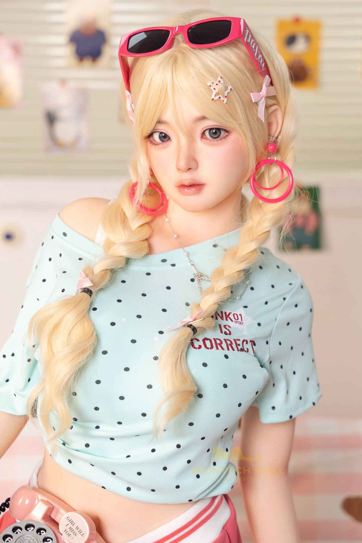 Irontech Doll 148 cm Plus B Silicone - Xia Ying full body side view in light blue polka dot crop shirt and pink skirt with blonde twin buns, bright kawaii bedroom background