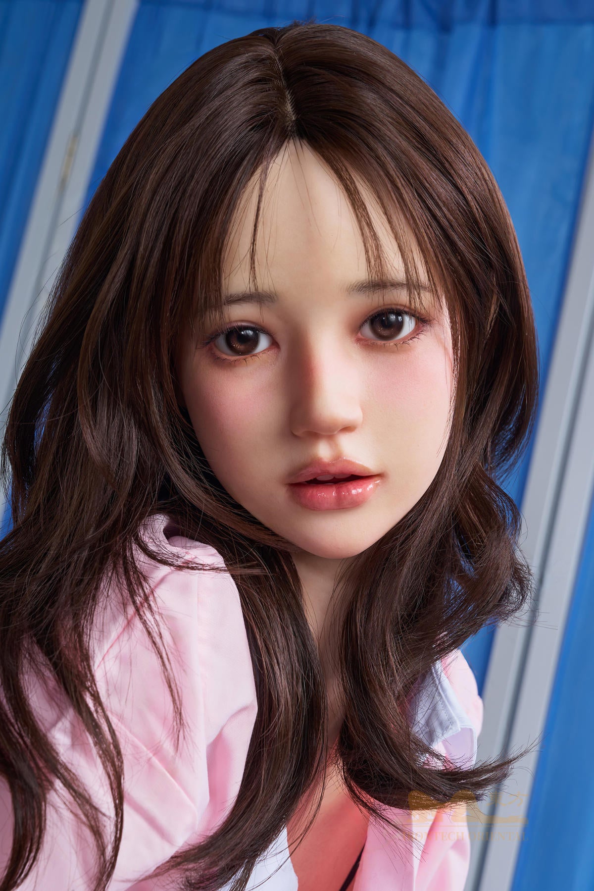Detailed face shot of the Irontech Doll 151 cm D Oriental Series Silicone – Evie wearing a pink open collar shirt.