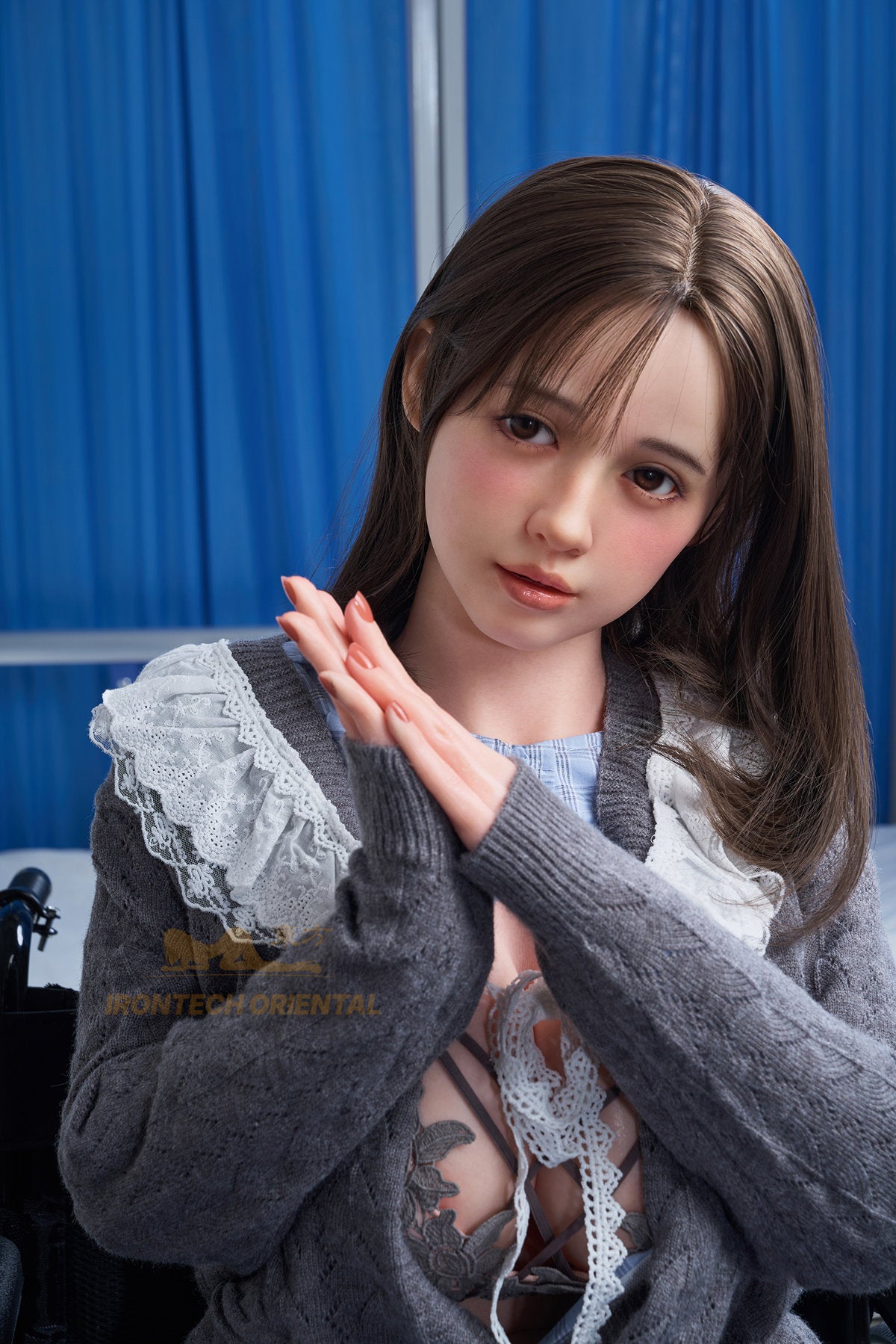 Mid-length front view of the Misaki V3 silicone doll wearing a grey patterned sweater with white faux-fur collar trim.