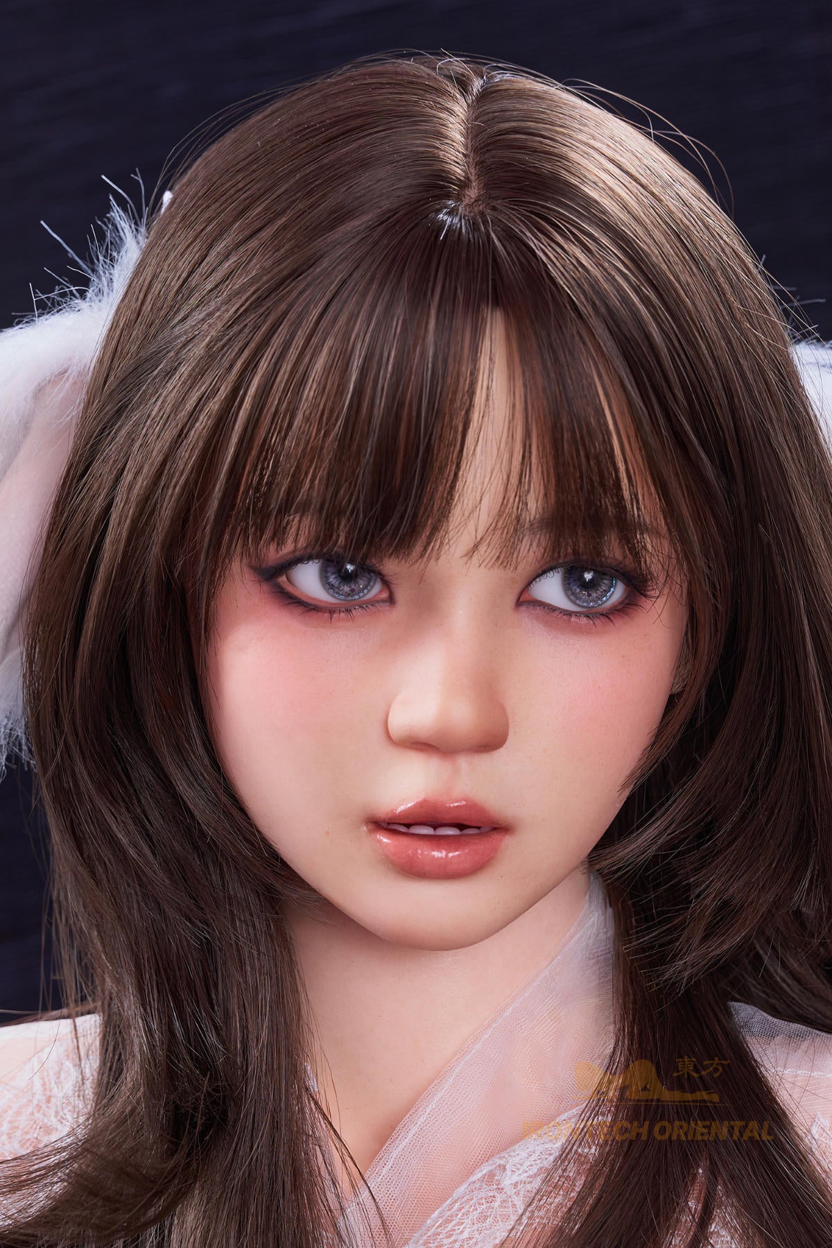 Irontech Doll 161 CM F Oriental Series Silicone - Nia V2 close-up portrait view highlighting realistic facial sculpt with long dark brown hair and soft natural features
