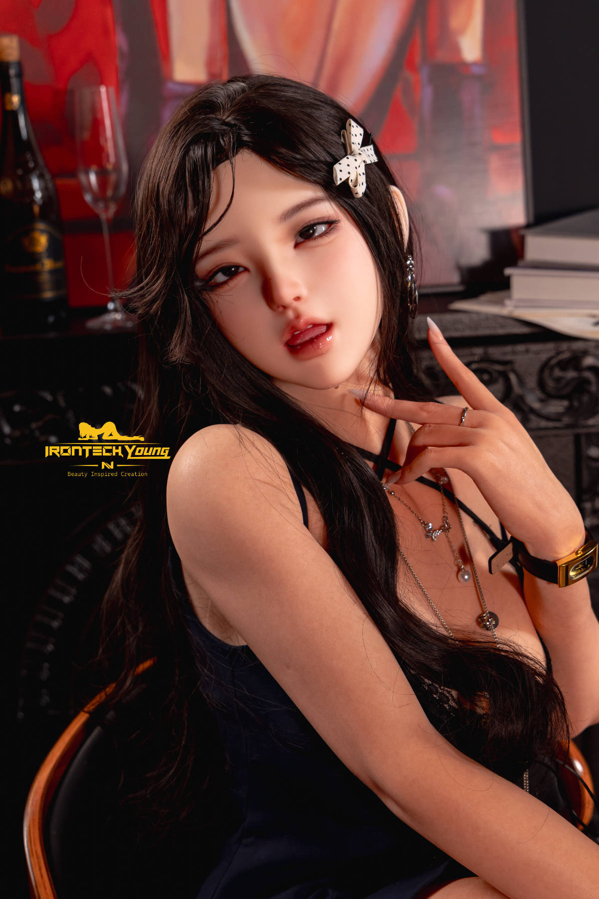 Irontech Doll 166 cm 2.0 Young Series E Silicone - Ria: three-quarter portrait in a navy dress, with soft lamplight behind her