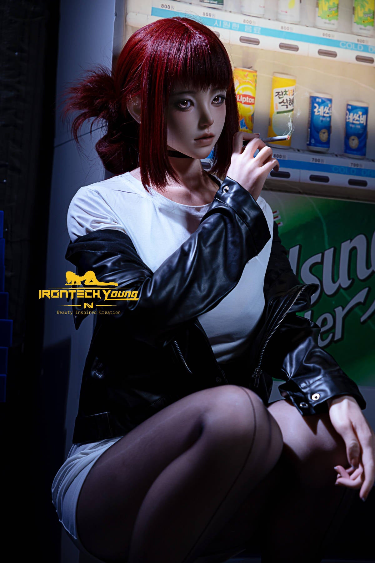 Irontech Doll 171 cm D Young Series Silicone - Ria – seated in a leather jacket and black tights, legs crossed