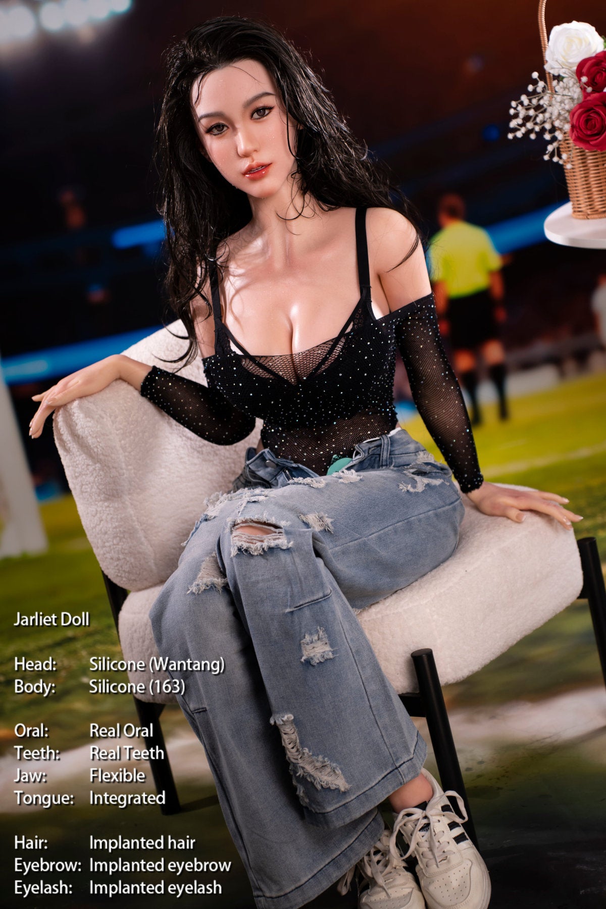 Jarliet Doll 163 cm D Silicone - Wantang seated with legs stretched out, black lace top and ripped denim, carnival lights behind her