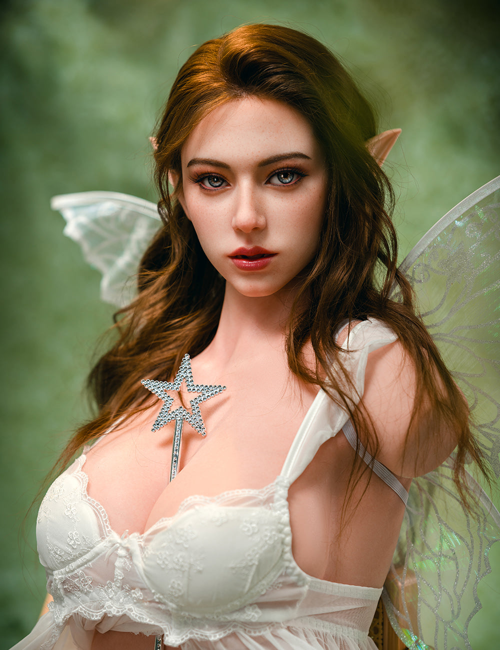Realistic silicone torso doll named Lindsay from TOP-CYDOLL, 110 cm E-cup model, shown with long brown hair, elf-like ears, and translucent fairy wings, wearing white lingerie.