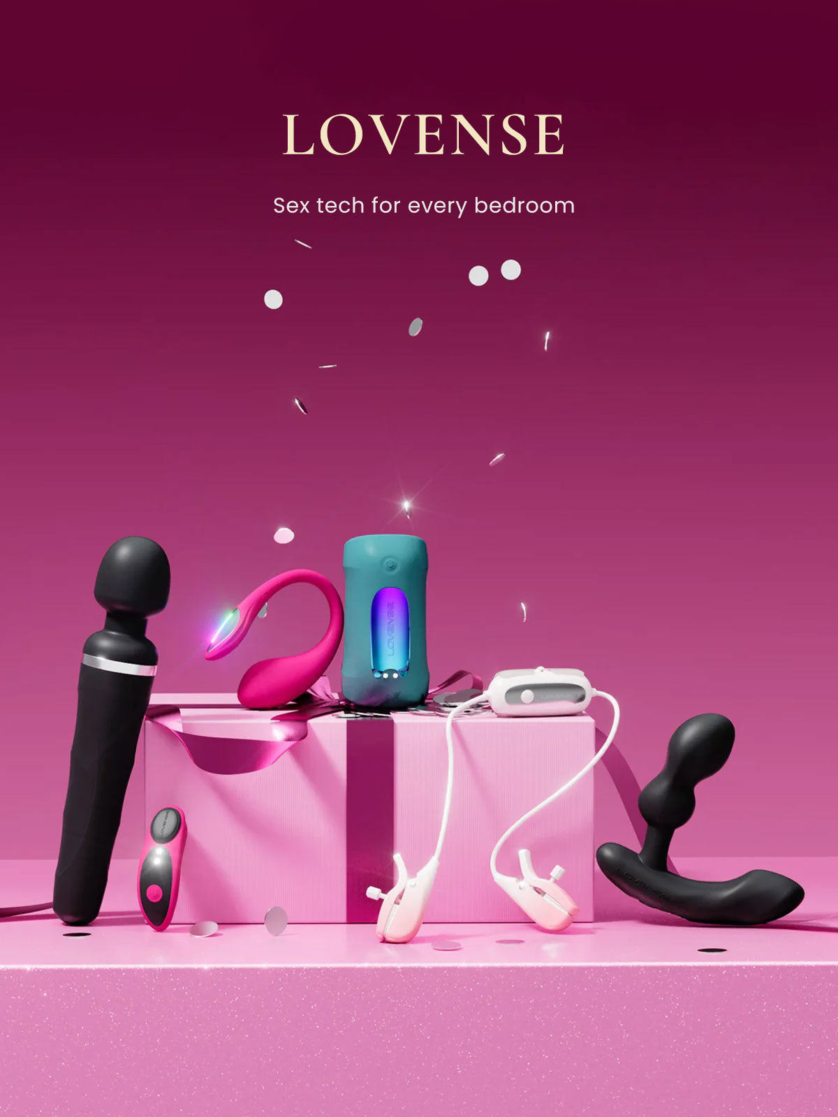 Collection of sex toys on a pink surface with 'LOVENSE' branding.