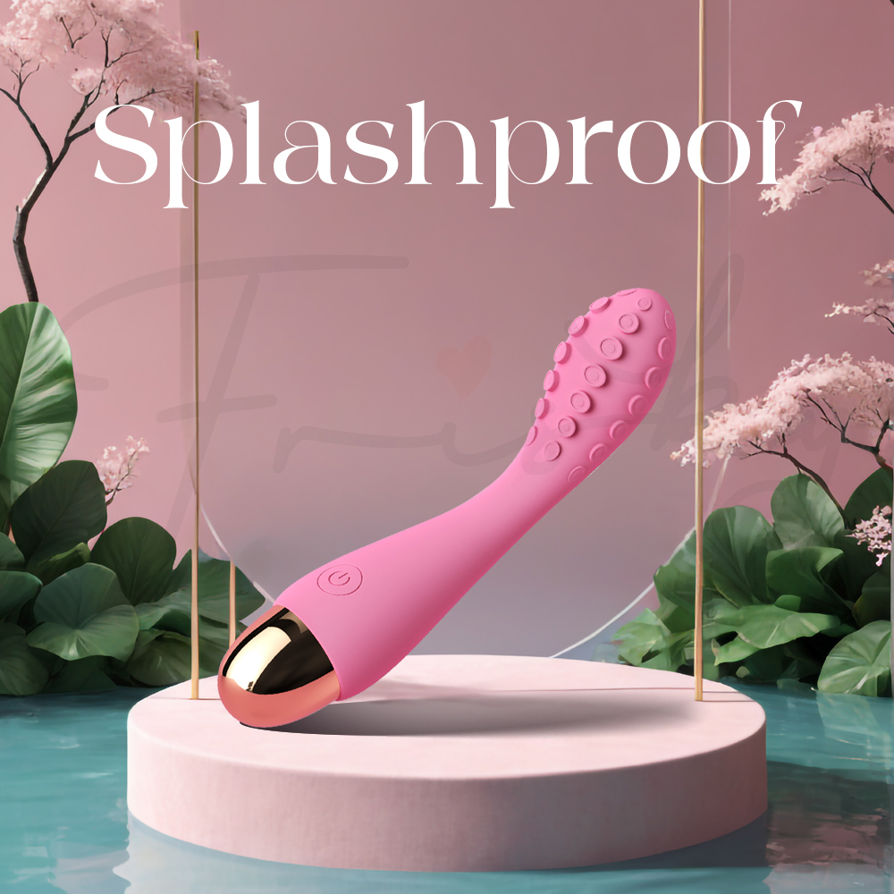 Splashproof vibrator shown with water splashes highlighting safe wet use